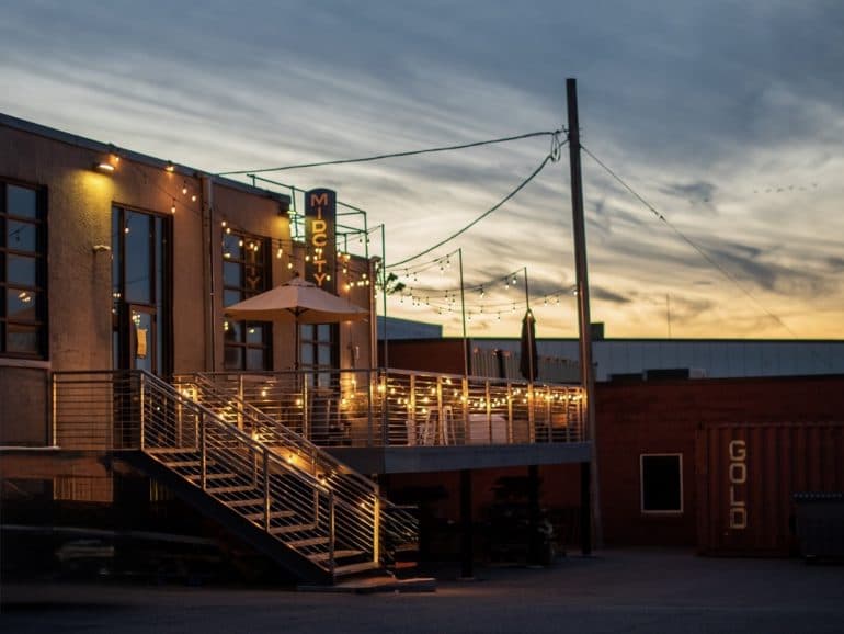 Nighttime exterior image of the patio of Khue's Kitchen restaurant.